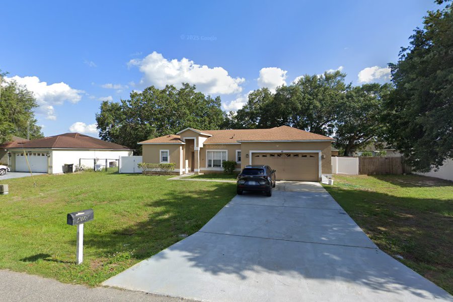 Street view of the Heart of the Family group home, a welcoming single-story home in Kissimmee, Florida